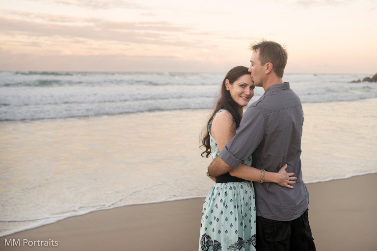 couple kissing on the beach