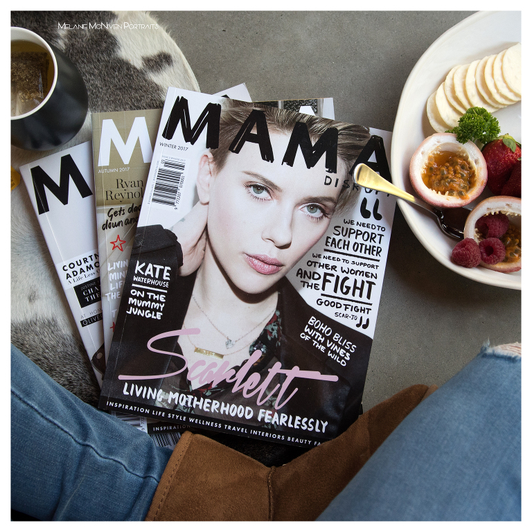 A flat lay image of a magazine on the floor with a fruit bowl. Magazines contain Noosa photography. 