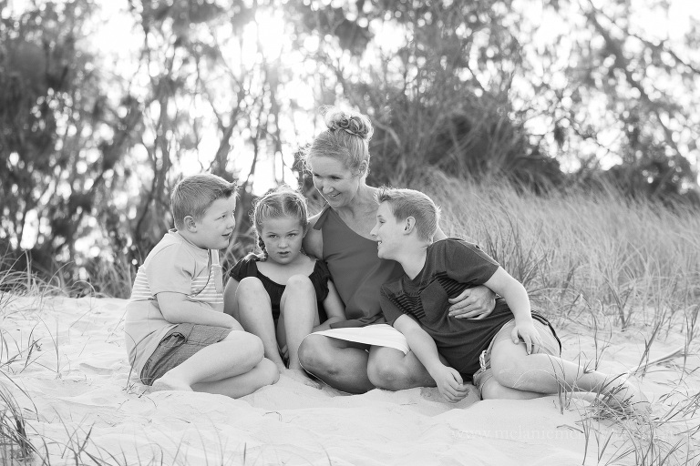 family of four on the beach