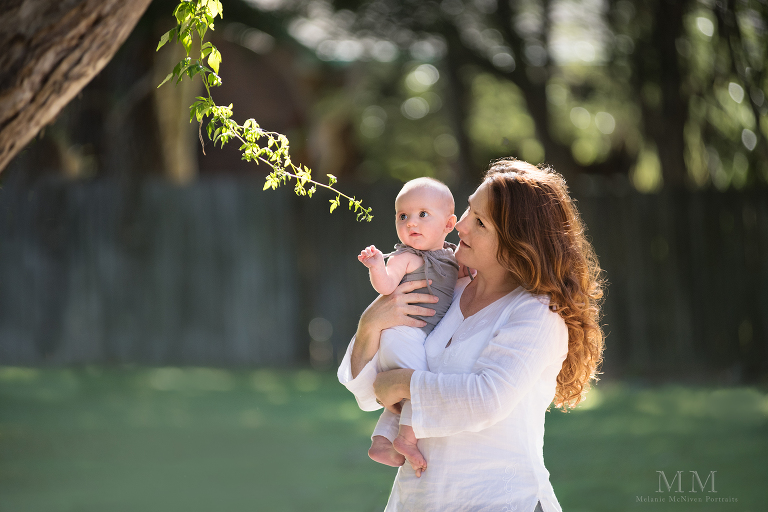 Mum and baby session exploring a tree branch