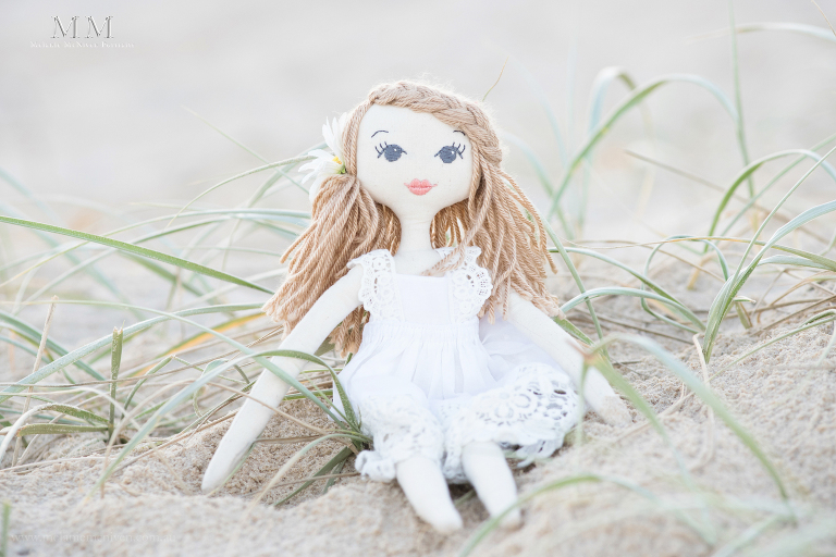 doll in the sand